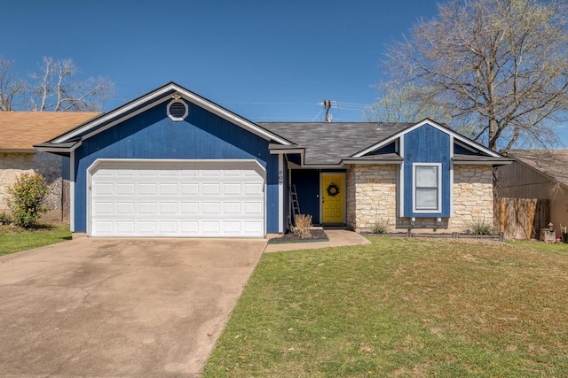 view of front of home with stone siding, a front lawn, an attached garage, a shingled roof, and driveway