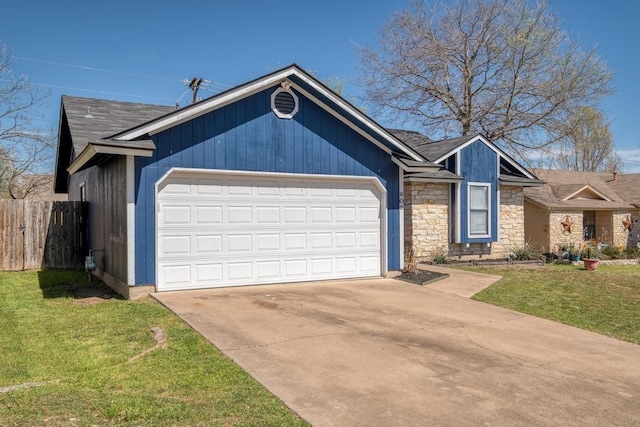 single story home featuring driveway, stone siding, an attached garage, a front yard, and fence