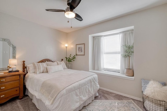 bedroom with baseboards, a ceiling fan, and carpet flooring