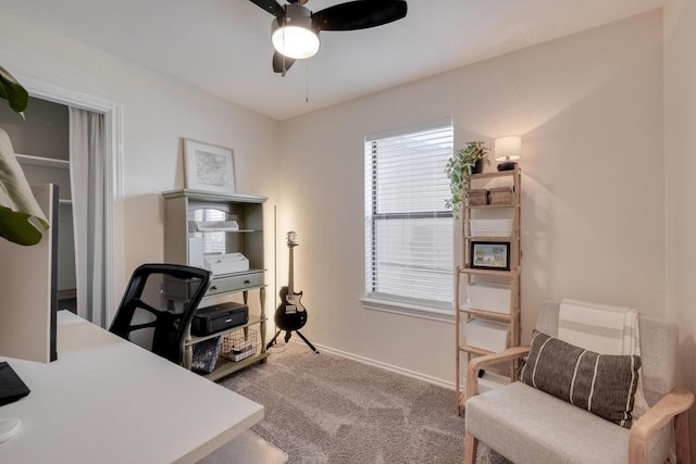 office space featuring ceiling fan, baseboards, and carpet