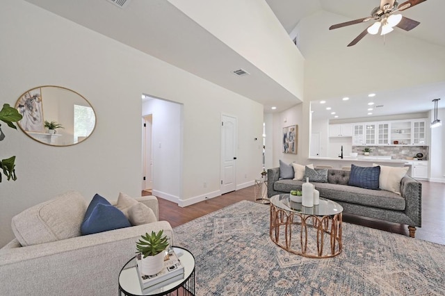 7802 Cheno Cortina Trl, Austin, TX 78749 - living room featuring a ceiling fan, wood finished floors, baseboards, visible vents, and recessed lighting