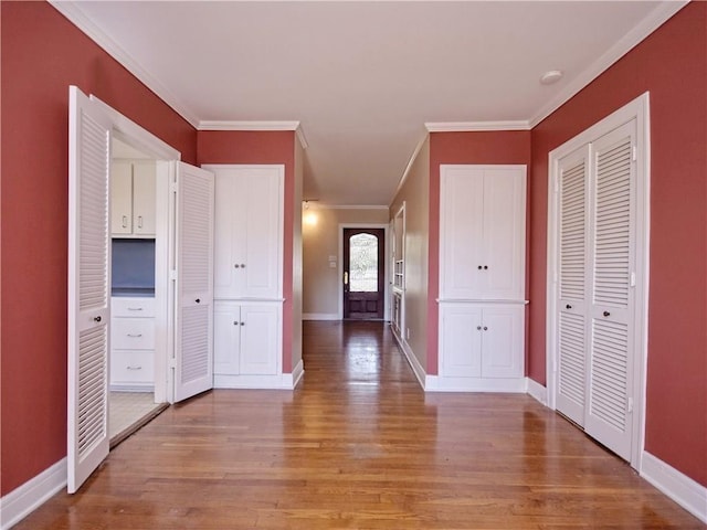 1621 Watchhill Rd, Austin, TX 78703 - entryway featuring crown molding, light wood-style flooring, and baseboards