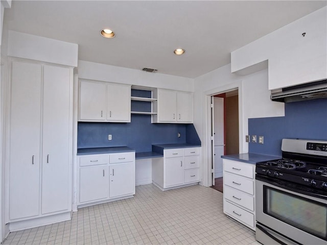 1621 Watchhill Rd, Austin, TX 78703 - kitchen featuring stainless steel gas stove, dark countertops, white cabinets, open shelves, and recessed lighting