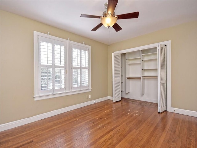 1621 Watchhill Rd, Austin, TX 78703 - unfurnished bedroom featuring hardwood / wood-style floors, baseboards, and a closet