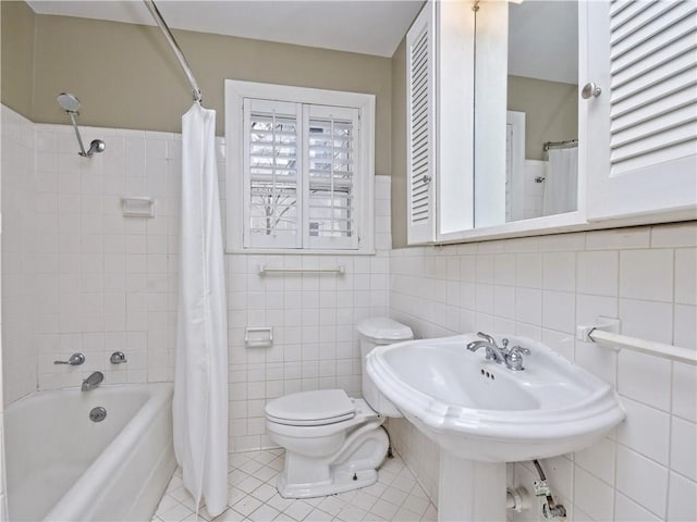 1621 Watchhill Rd, Austin, TX 78703 - bathroom with tile walls, tile patterned flooring, shower / bath combination with curtain, toilet, and a wainscoted wall