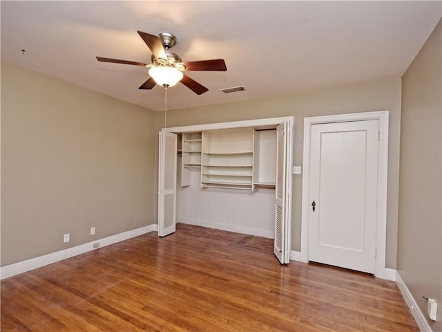1621 Watchhill Rd, Austin, TX 78703 - unfurnished bedroom with two closets, wood finished floors, and baseboards