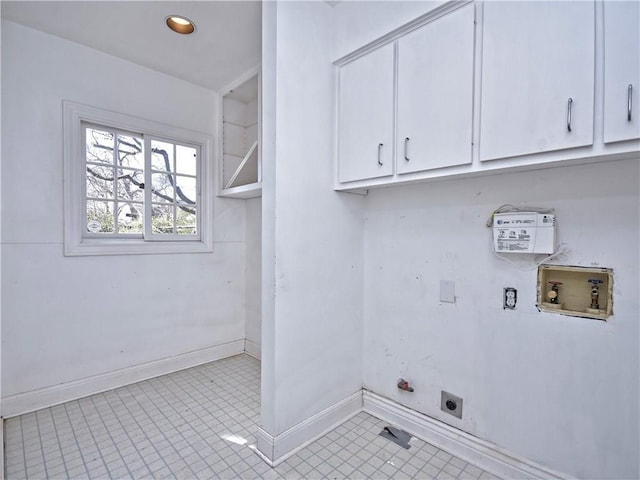 1621 Watchhill Rd, Austin, TX 78703 - laundry room with hookup for an electric dryer, cabinet space, hookup for a washing machine, baseboards, and tile patterned floors