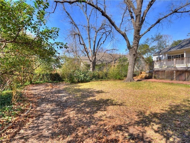 view of yard with a wooden deck