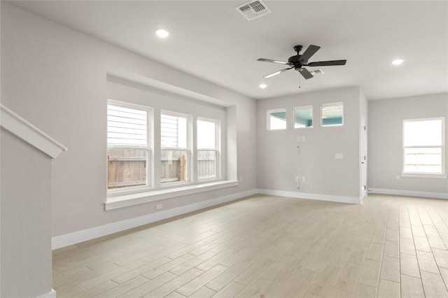 9708 Petrichor Blvd, Manor, TX 78653 - unfurnished living room with light wood-style flooring, baseboards, a ceiling fan, and recessed lighting