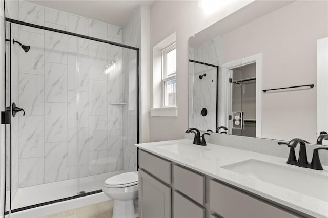 9708 Petrichor Blvd, Manor, TX 78653 - full bath featuring toilet, a marble finish shower, double vanity, and a spacious closet