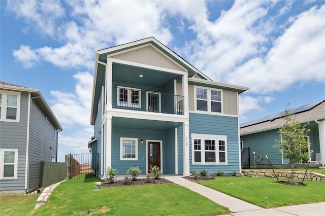 9708 Petrichor Blvd, Manor, TX 78653 - view of front facade featuring a balcony and board and batten siding