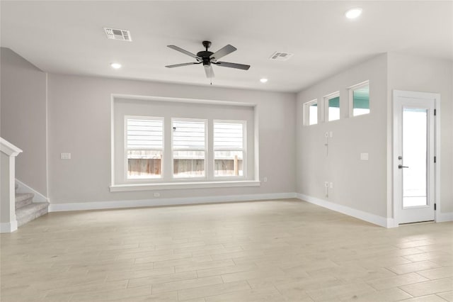 9708 Petrichor Blvd, Manor, TX 78653 - unfurnished living room with ceiling fan, stairway, baseboards, recessed lighting, and light wood finished floors