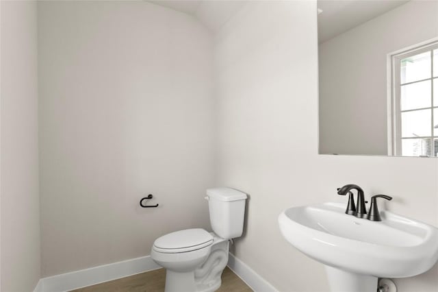 9708 Petrichor Blvd, Manor, TX 78653 - half bath featuring toilet, wood finished floors, baseboards, and a sink