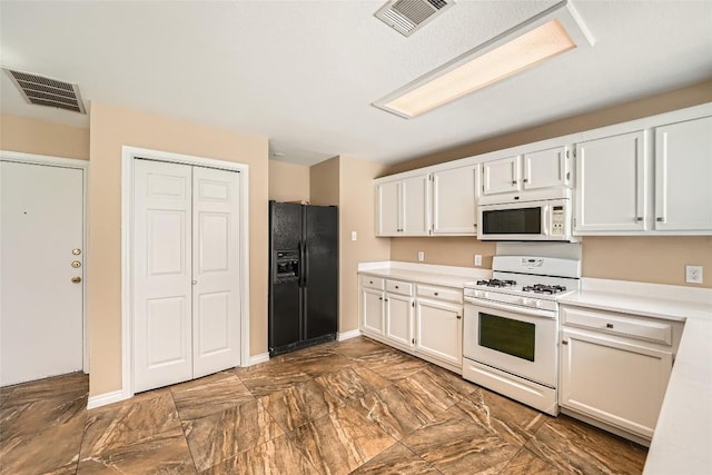 2813 Single Trace Ct, Austin, TX 78728 - kitchen with light countertops, white appliances, and visible vents
