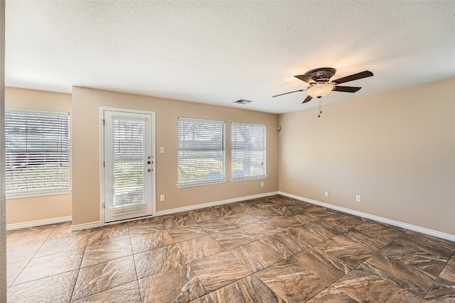 2813 Single Trace Ct, Austin, TX 78728 - unfurnished room featuring visible vents, a textured ceiling, baseboards, and ceiling fan