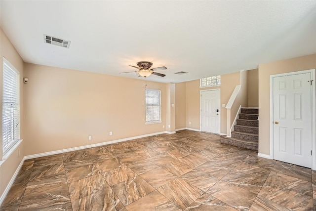 2813 Single Trace Ct, Austin, TX 78728 - spare room with visible vents, ceiling fan, stairway, and baseboards
