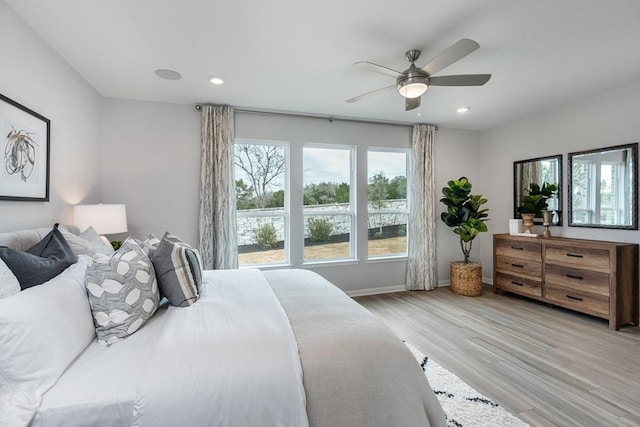9709 Boathouse Dr, Austin, TX 78744 - bedroom featuring light wood-style floors, recessed lighting, baseboards, and a ceiling fan