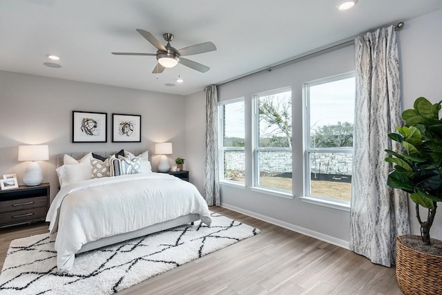 9709 Boathouse Dr, Austin, TX 78744 - bedroom with wood finished floors, baseboards, recessed lighting, and a ceiling fan
