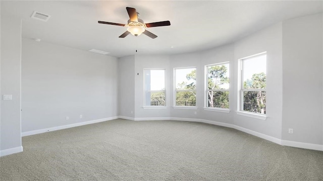 9709 Boathouse Dr, Austin, TX 78744 - spare room featuring carpet floors, baseboards, and a ceiling fan
