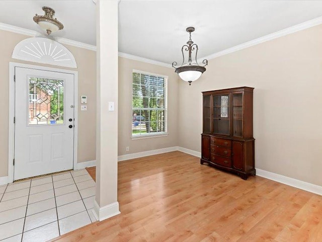 906 Woodhollow Ln, Cedar Park, TX 78613 - foyer featuring light wood-type flooring, ornamental molding, and baseboards