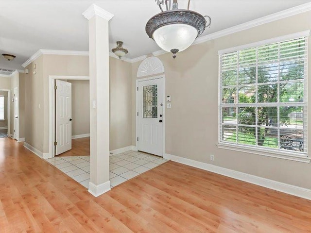 906 Woodhollow Ln, Cedar Park, TX 78613 - foyer featuring baseboards, visible vents, ornamental molding, and light wood-type flooring