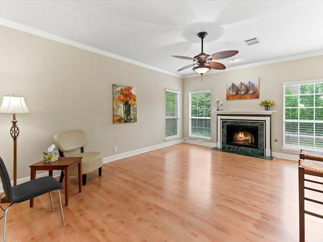 906 Woodhollow Ln, Cedar Park, TX 78613 - living room featuring visible vents, ornamental molding, baseboards, and a ceiling fan