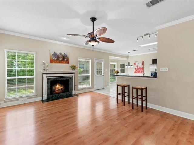 906 Woodhollow Ln, Cedar Park, TX 78613 - living room featuring visible vents, ornamental molding, ceiling fan, and a fireplace