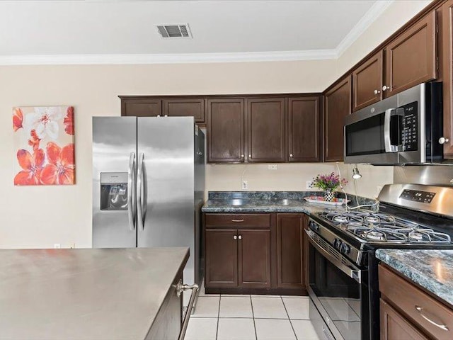 906 Woodhollow Ln, Cedar Park, TX 78613 - kitchen with crown molding, light tile patterned flooring, dark brown cabinets, stainless steel appliances, and visible vents