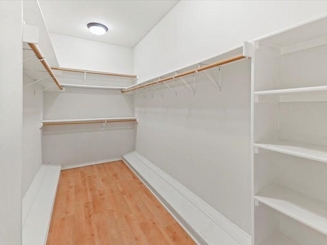 906 Woodhollow Ln, Cedar Park, TX 78613 - spacious closet with wood finished floors