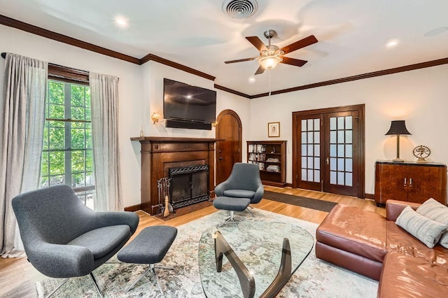 809 Edgecliff Ter, Austin, TX 78704 - living area featuring ceiling fan, baseboards, wood finished floors, a fireplace with flush hearth, and ornamental molding