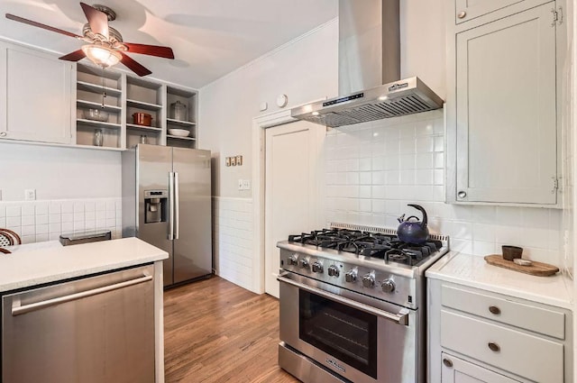 809 Edgecliff Ter, Austin, TX 78704 - kitchen featuring appliances with stainless steel finishes, wall chimney range hood, a ceiling fan, light countertops, and open shelves