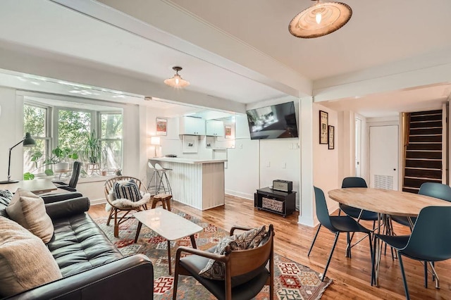 809 Edgecliff Ter, Austin, TX 78704 - living room featuring light wood-style floors, stairs, and baseboards