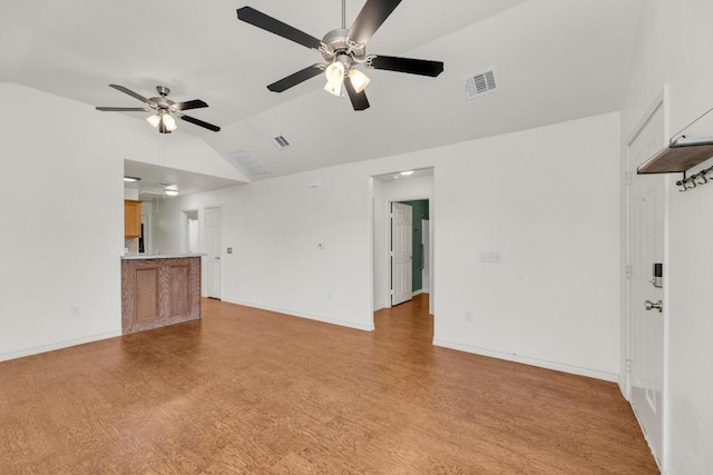 128 2nd Ave, Taylor, TX 76574 - unfurnished living room featuring light wood-type flooring, lofted ceiling, and ceiling fan