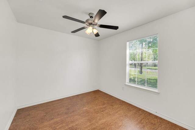 128 2nd Ave, Taylor, TX 76574 - empty room featuring wood finished floors and a ceiling fan