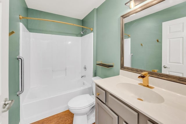128 2nd Ave, Taylor, TX 76574 - full bathroom with vanity, washtub / shower combination, and wood finished floors
