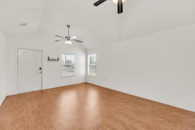 128 2nd Ave, Taylor, TX 76574 - empty room with a ceiling fan, vaulted ceiling, and wood finished floors
