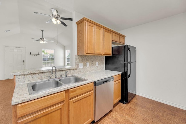 128 2nd Ave, Taylor, TX 76574 - kitchen featuring dishwasher, lofted ceiling, ceiling fan, light countertops, and freestanding refrigerator