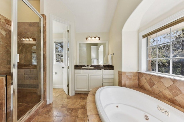 201 Mcconnell Dr, West Lake Hills, TX 78746 - bathroom with a whirlpool tub, vanity, a shower stall, and lofted ceiling