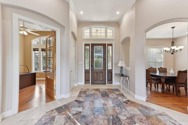 201 Mcconnell Dr, West Lake Hills, TX 78746 - foyer entrance with arched walkways, a chandelier, recessed lighting, and a ceiling fan