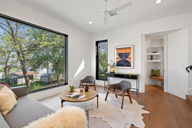 2218 Haskell St, Austin, TX 78702 - sitting room with a ceiling fan, recessed lighting, wood finished floors, and baseboards
