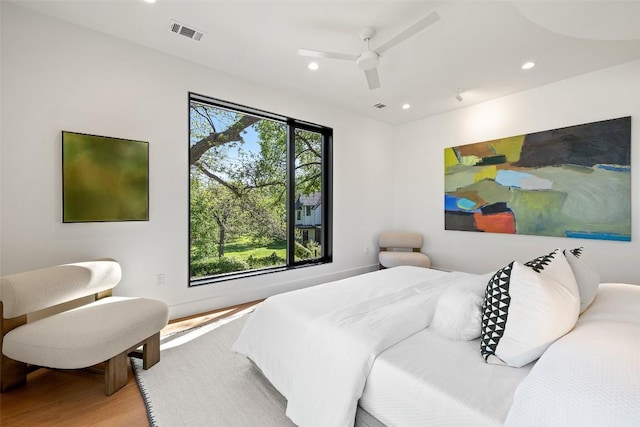 2218 Haskell St, Austin, TX 78702 - bedroom with wood finished floors, recessed lighting, and ceiling fan
