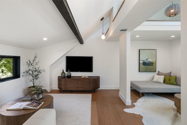2218 Haskell St, Austin, TX 78702 - living area with wood finished floors, baseboards, recessed lighting, and beamed ceiling
