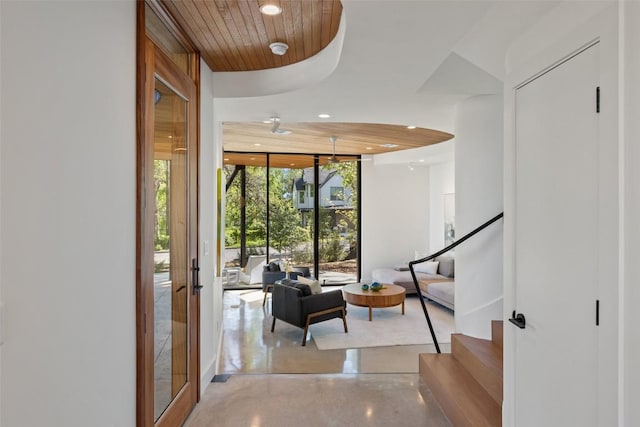 2218 Haskell St, Austin, TX 78702 - foyer with recessed lighting, stairs, wooden ceiling, finished concrete floors, and expansive windows