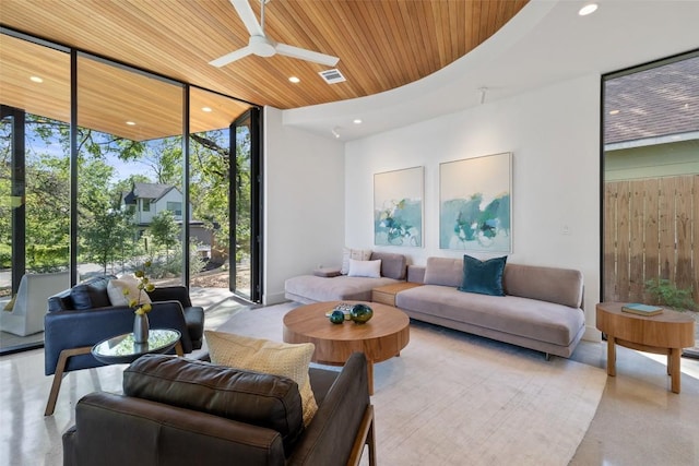 2218 Haskell St, Austin, TX 78702 - living room with wood ceiling, expansive windows, ceiling fan, and recessed lighting
