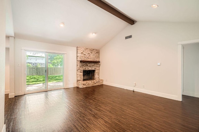 2700 Coatbridge Dr, Austin, TX 78745 - unfurnished living room with visible vents, baseboards, lofted ceiling with beams, a stone fireplace, and dark wood-type flooring