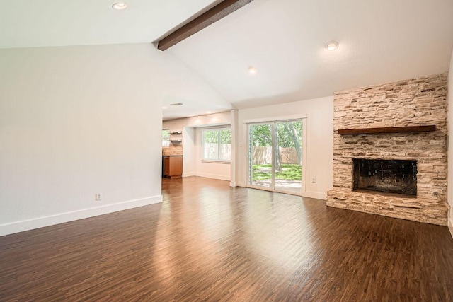 2700 Coatbridge Dr, Austin, TX 78745 - unfurnished living room featuring dark wood-style flooring, a fireplace, vaulted ceiling with beams, and baseboards