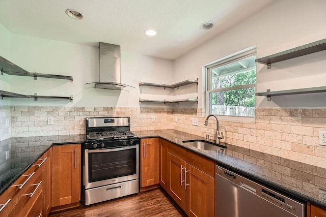 2700 Coatbridge Dr, Austin, TX 78745 - kitchen featuring dark stone countertops, open shelves, wall chimney exhaust hood, a sink, and appliances with stainless steel finishes