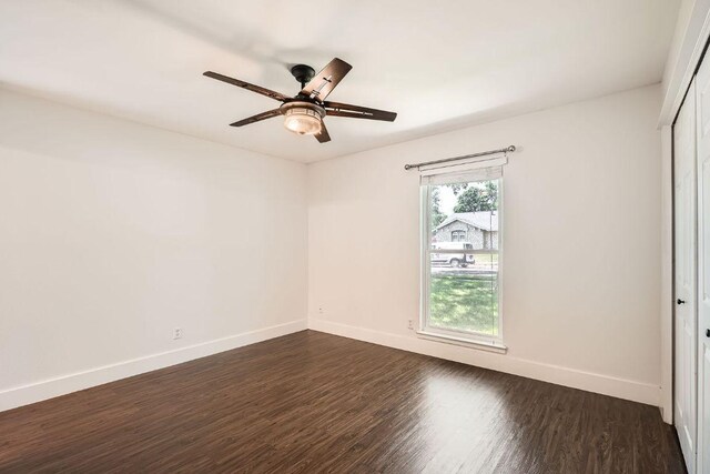 2700 Coatbridge Dr, Austin, TX 78745 - unfurnished room with ceiling fan, baseboards, and dark wood finished floors