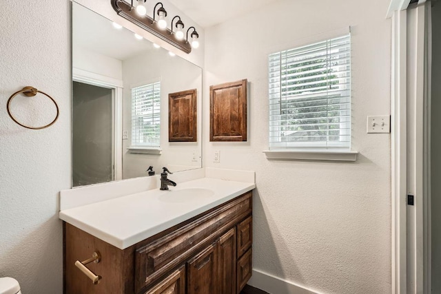 2700 Coatbridge Dr, Austin, TX 78745 - bathroom featuring vanity and a textured wall
