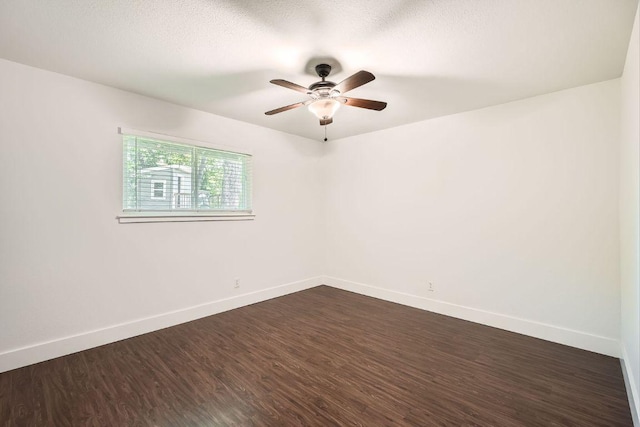 2700 Coatbridge Dr, Austin, TX 78745 - empty room featuring dark wood-style floors, baseboards, a ceiling fan, and a textured ceiling
